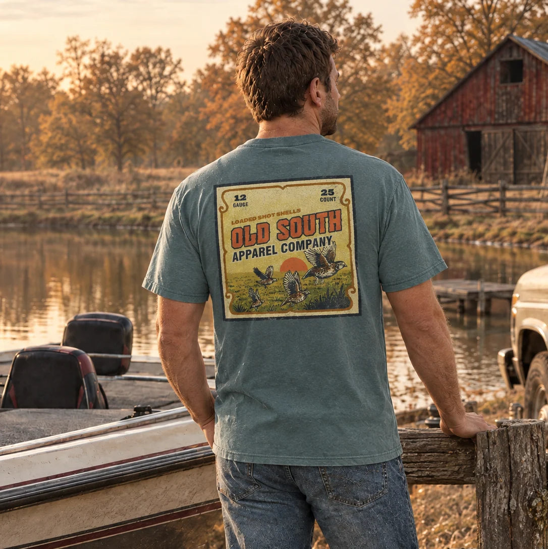 Old South Apparel Vintage Shotgun Shell Box short sleeve tee in Blue Spruce with a front pocket logo and hand-drawn vintage hunting graphic on the back.