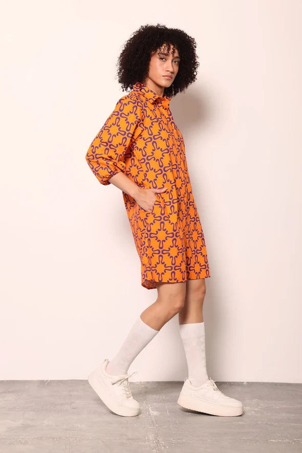 Woman wearing the Maude Vivante Ava Dress in the Tigers print, featuring an artistic tiger-inspired pattern, collared button-front design, three-quarter balloon sleeves, contrast trim, and a relaxed A-line silhouette.