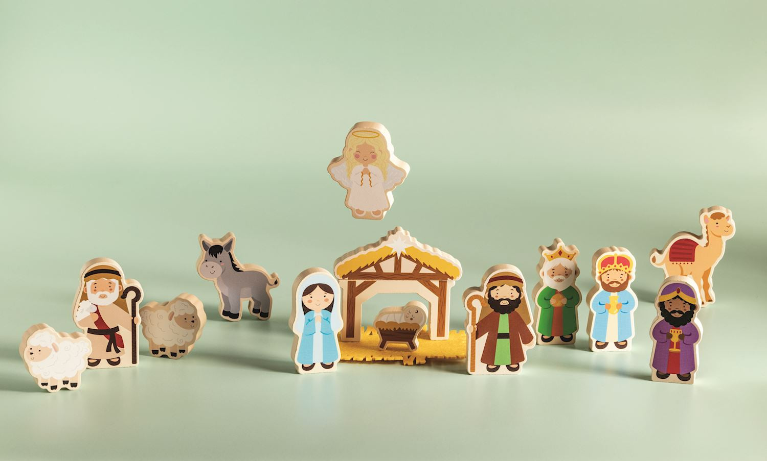 Mud Pie Nativity Wood Toy Set featuring wooden Nativity figures, animals, baby Jesus, manger, and hay for children's Christmas play.