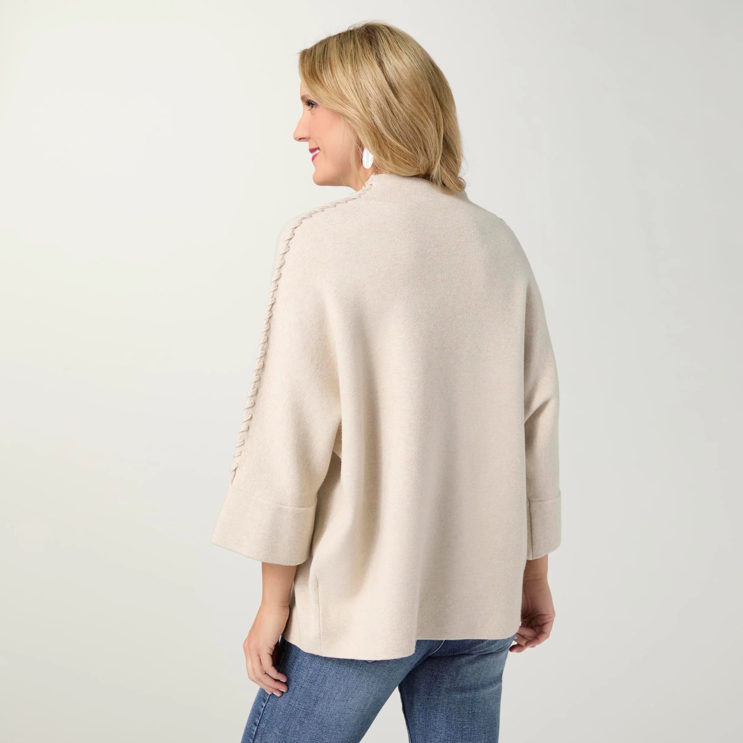 Coco + Carmen Heavenly-Luxe Stitch Detail Funnel Neck Sweater, available in Oatmeal and Black, featuring a soft knit, textured stitch detailing, relaxed fit, and funnel neckline.