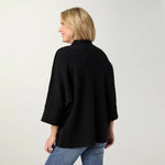 Coco + Carmen Heavenly-Luxe Stitch Detail Funnel Neck Sweater, available in Oatmeal and Black, featuring a soft knit, textured stitch detailing, relaxed fit, and funnel neckline.