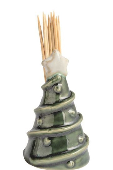 Four small ceramic toothpick holders shaped like a house with a green wreath, a snowman, a Santa figure, and a Christmas tree, arranged in a row on a white background.