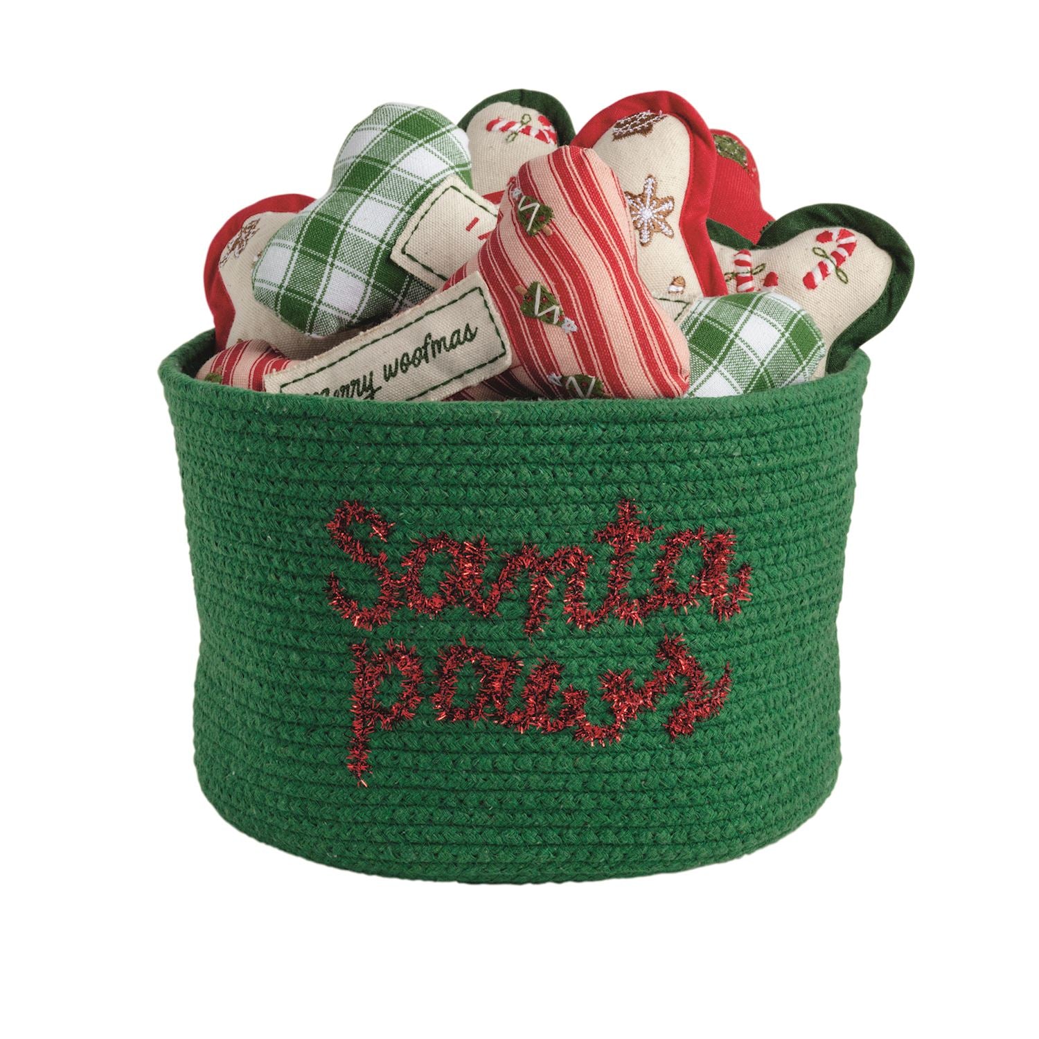 Green basket with 'Santa Paws' text containing Christmas-themed dog toys on a white background