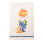 Decorative towel with pumpkins and a blue vase design on a white background