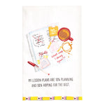A white kitchen tea towel featuring a watercolor illustration of a planner, coffee cup, and pen, with the text 'MY LESSON PLANS ARE 10% PLANNING AND 90% HOPING FOR THE BEST.' at the bottom.