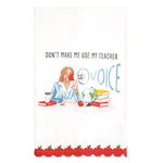 A white kitchen tea towel featuring a watercolor-style illustration of a teacher at a desk with a megaphone, books, and an apple, with the text 'DON'T MAKE ME USE MY TEACHER' above. The bottom edge has a decorative border of red apples with green leaves.