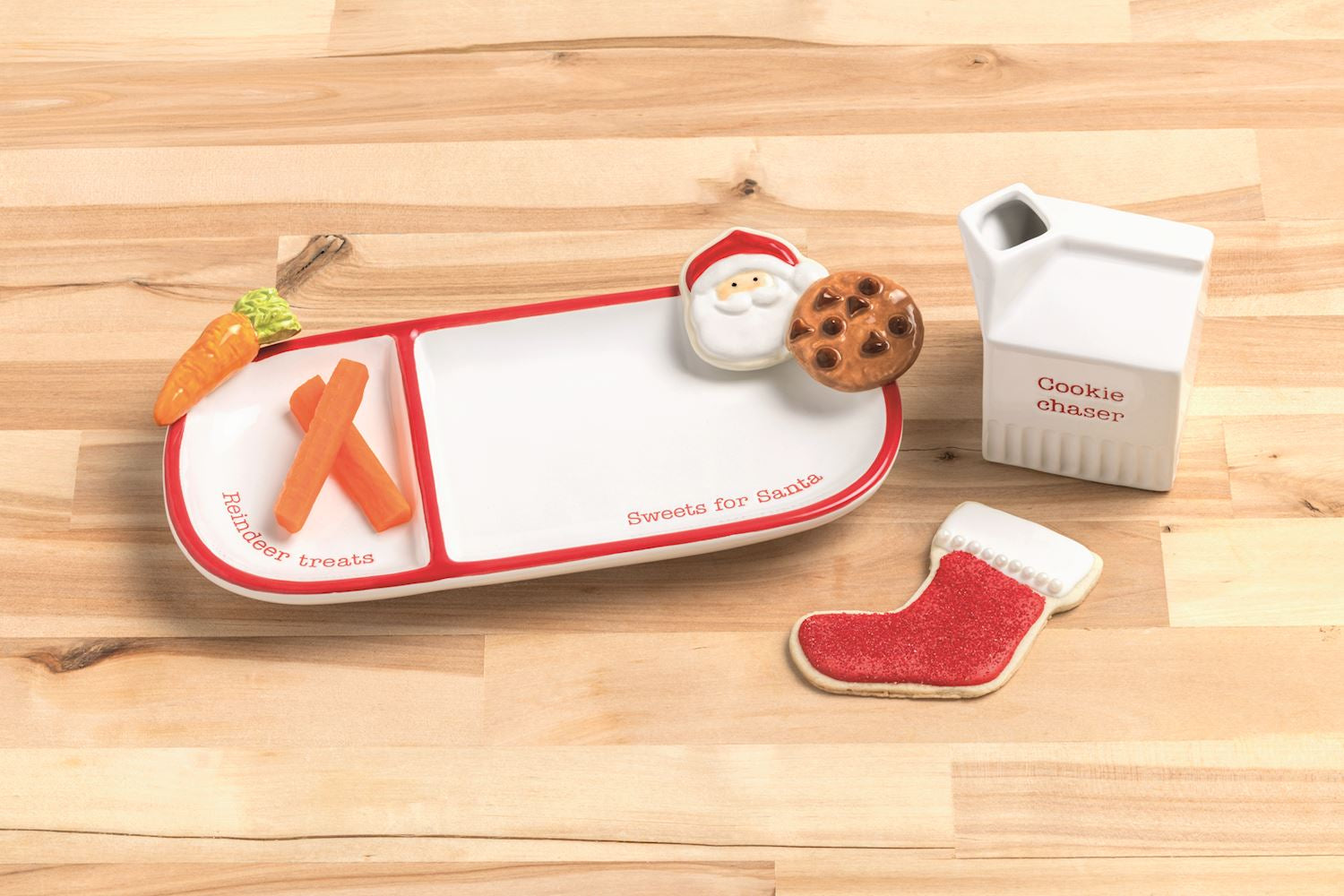 Set of Christmas-themed cookie cutters on a wooden surface
