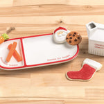 Set of Christmas-themed cookie cutters on a wooden surface
