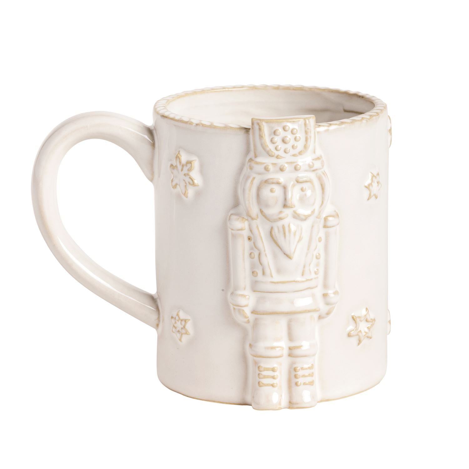 An off-white ceramic mug featuring a raised nutcracker figure on the front and small embossed star details, set against a plain white background.