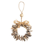 A rustic hanging wreath ornament made from natural driftwood shells, tied with a jute bow and hanging from a wooden bead and twine loop, shown on a plain white background.