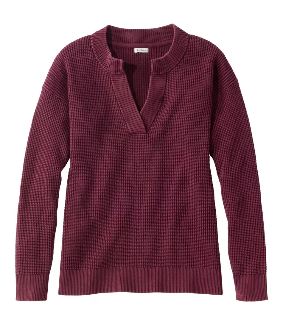 A women's long-sleeve waffle-knit sweater in a deep burgundy or plum color, featuring a split V-neck collar, shown flat against a white background.