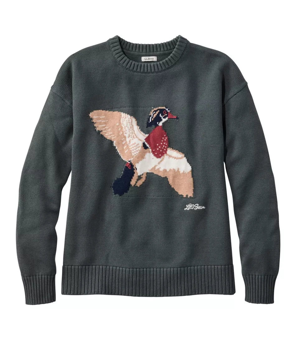 A dark gray knit crewneck sweater featuring a large, detailed knitted graphic of a flying duck on the front, with a small white script logo near the lower right of the duck.