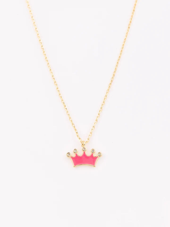 A gold chain necklace with a small crown pendant featuring bright pink enamel inlay and tiny clear rhinestone accents, shown against a plain white background.