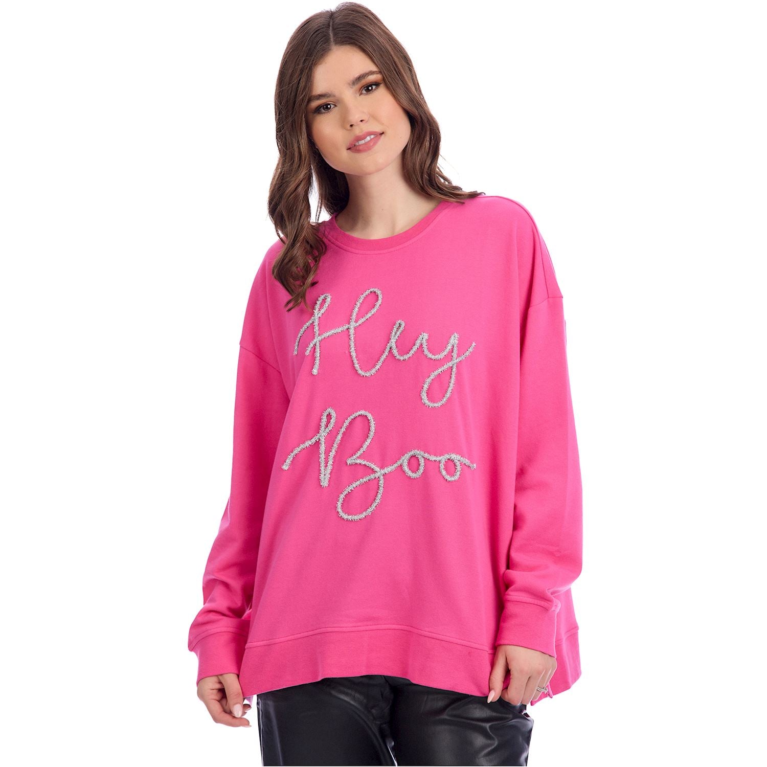 Woman wearing a pink sweatshirt with 'Hey Boo' text on a white background
