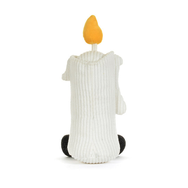 A white ribbed-texture plush candle toy with a yellow flame on a white background.