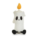 A cute ghost-shaped candle plush toy made from a white ribbed knit sock, featuring a yellow fabric candle flame on top, embroidered black eyes and mouth, and black textured feet, set against a plain white background.