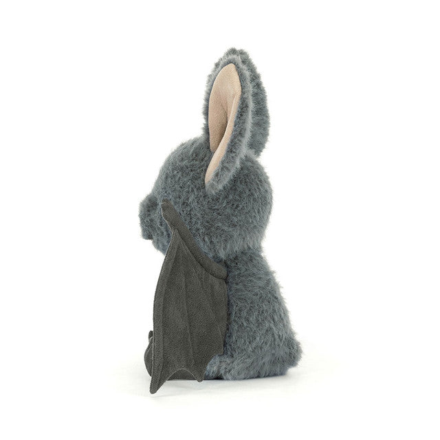JellyCat Broox Bat plush featuring soft charcoal-grey fur, oversized ears, textured bat wings, and a sweet embroidered face, perfect for Halloween and fall.