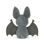 JellyCat Broox Bat plush featuring soft charcoal-grey fur, oversized ears, textured bat wings, and a sweet embroidered face, perfect for Halloween and fall.