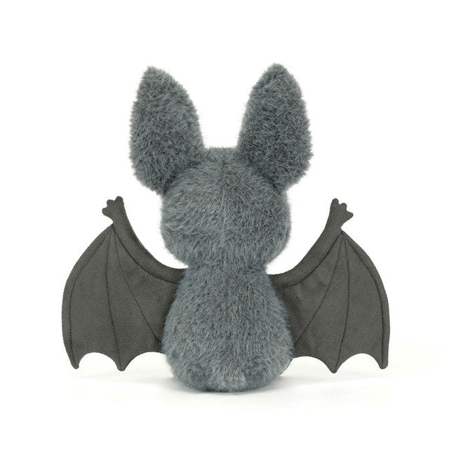 JellyCat Broox Bat plush featuring soft charcoal-grey fur, oversized ears, textured bat wings, and a sweet embroidered face, perfect for Halloween and fall.