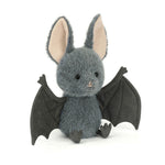 ellyCat Broox Bat plush featuring soft charcoal-grey fur, oversized ears, textured bat wings, and a sweet embroidered face, perfect for Halloween and fall.