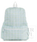 A light blue and green plaid backpack with a white top handle, shown against a plain white background. A faint 'TRVL design' watermark is visible in the lower right corner.