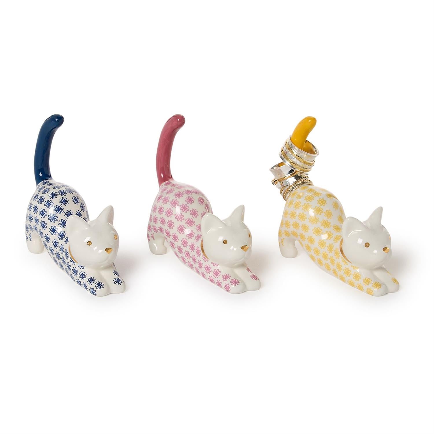 Three cat-shaped ceramic holders with patterned bodies on a white background
