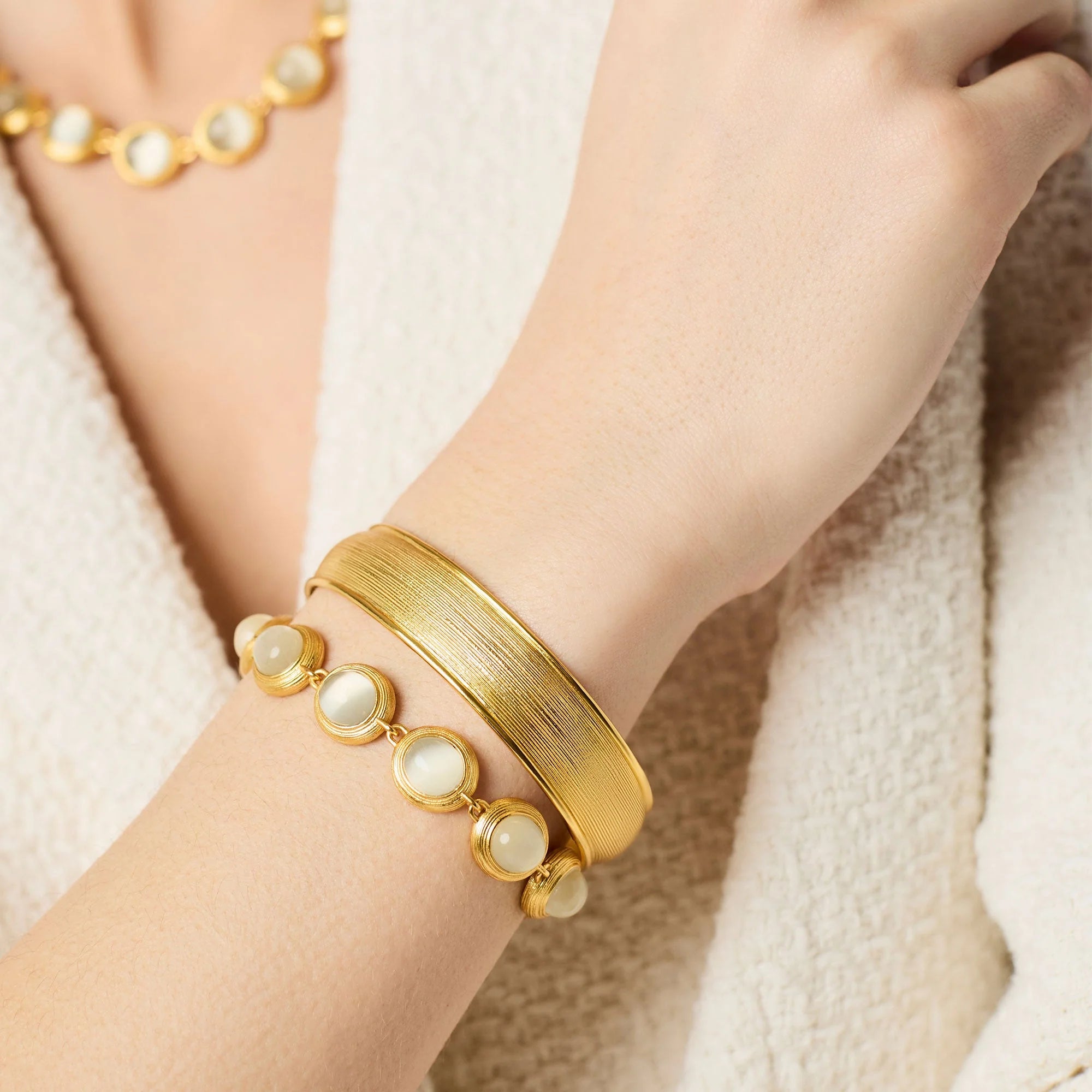 Julie Vos Cobblestone Hinge Bangle featuring a sculptural 24K gold-plated design with softly rounded cobblestone-inspired details and an easy hinged closure.