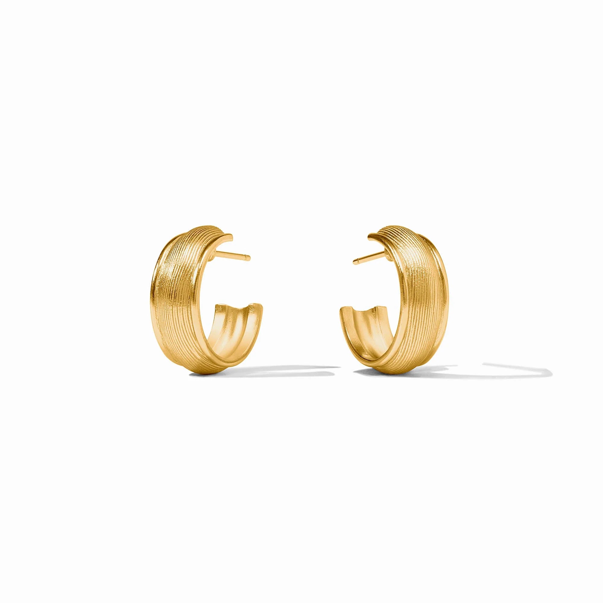 Pair of gold hoop earrings on a white background
