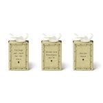 Three decorative boxes with white birds on top, each containing a motivational quote.