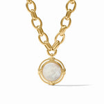 Gold chain necklace with a pendant featuring a white stone on a white background