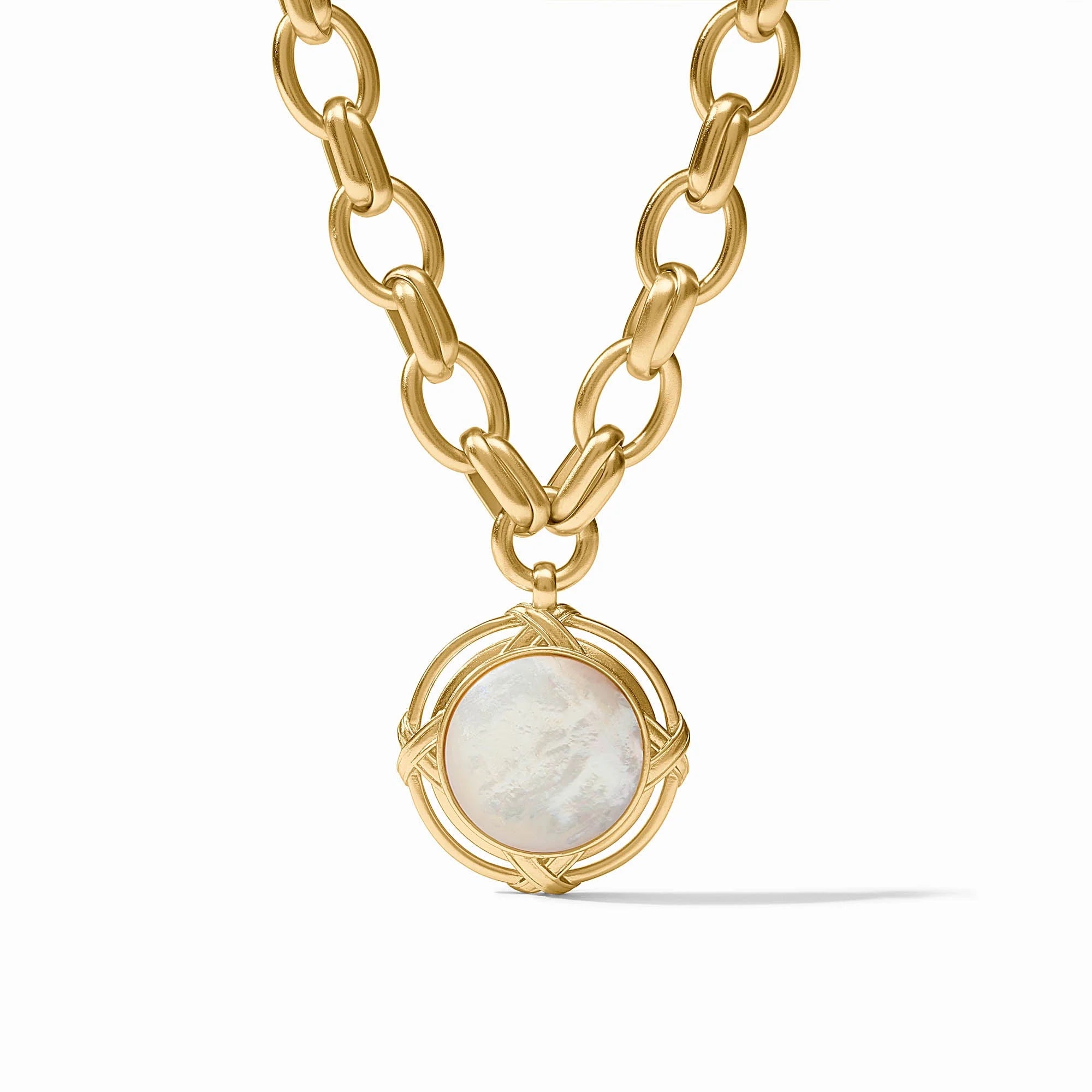 Gold chain necklace with a pendant featuring a white stone on a white background