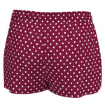 A pair of women's shorts in a deep burgundy red with a white polka dot pattern, shown against a plain white background.