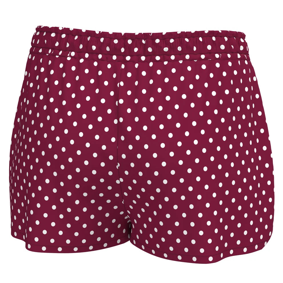 A pair of women's shorts in a deep burgundy red with a white polka dot pattern, shown against a plain white background.
