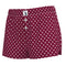 A pair of women's shorts in burgundy with a white polka dot pattern, featuring a button-fly front and a small white brand label on the waistband.