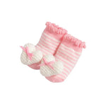 Pink and white striped knit baby booties with white heart-shaped toe covers and small pink bows, shown on a plain white background.