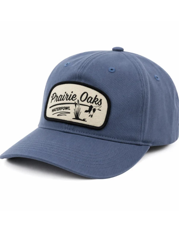 Prairie Oaks Waterfowl Landing Duck Patch Rope Hat in washed blue featuring a vintage-inspired front patch with landing duck and marsh artwork
