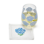 Stemless 16-ounce wine glass featuring blue hydrangea blooms and green leaves for a fresh, garden-inspired barware accent.