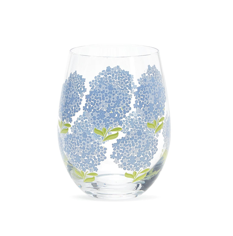 Stemless 16-ounce wine glass featuring blue hydrangea blooms and green leaves for a fresh, garden-inspired barware accent.