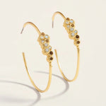 Spartina 449 Vesper Hoop Earrings featuring lightweight, textured 24kt matte gold skinny hoops accented with white opals and sparkling glass crystals.