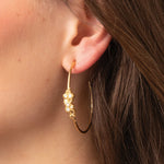 Spartina 449 Vesper Hoop Earrings featuring lightweight, textured 24kt matte gold skinny hoops accented with white opals and sparkling glass crystals.
