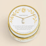 A gold-plated 18-inch necklace with a clear crystal pendant, presented on a white and gold round gift box with the word 'FANTASTIC' printed on the card insert, set against a solid beige background.