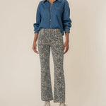KUT from the Kloth Kelsey High Rise Flare jeans in a tan and brown animal print with a flattering high-rise fit and raw hem.