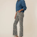 KUT from the Kloth Kelsey High Rise Flare jeans in a tan and brown animal print with a flattering high-rise fit and raw hem.