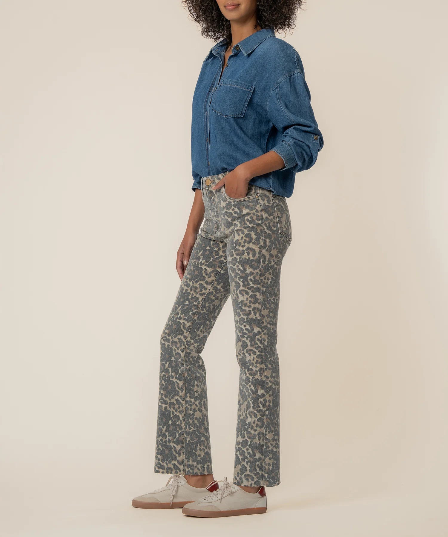 KUT from the Kloth Kelsey High Rise Flare jeans in a tan and brown animal print with a flattering high-rise fit and raw hem.