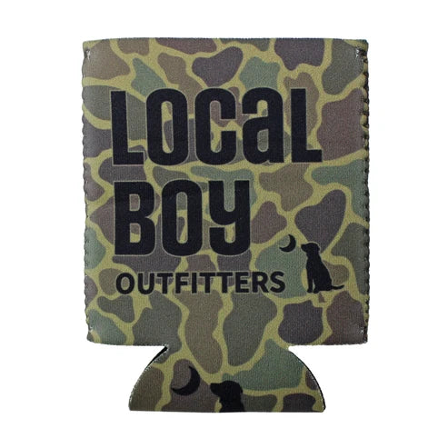 A beverage can cooler sleeve with a green, brown, and beige camouflage pattern, featuring the text 'LOCAL BOY OUTFITTERS' and a black silhouette of a dog looking up at a moon.