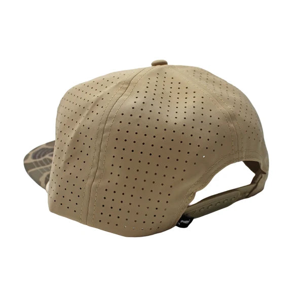 A tan baseball cap with a perforated fabric crown and a camouflage-patterned visor, shown from a three-quarters back angle on a white background.
