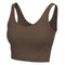 A solid brown sports bra with a wide scoop neckline and wide shoulder straps, shown against a plain white background.