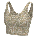 A women's sports bra with a camouflage pattern in shades of beige, tan, and olive green, shown against a plain white background.