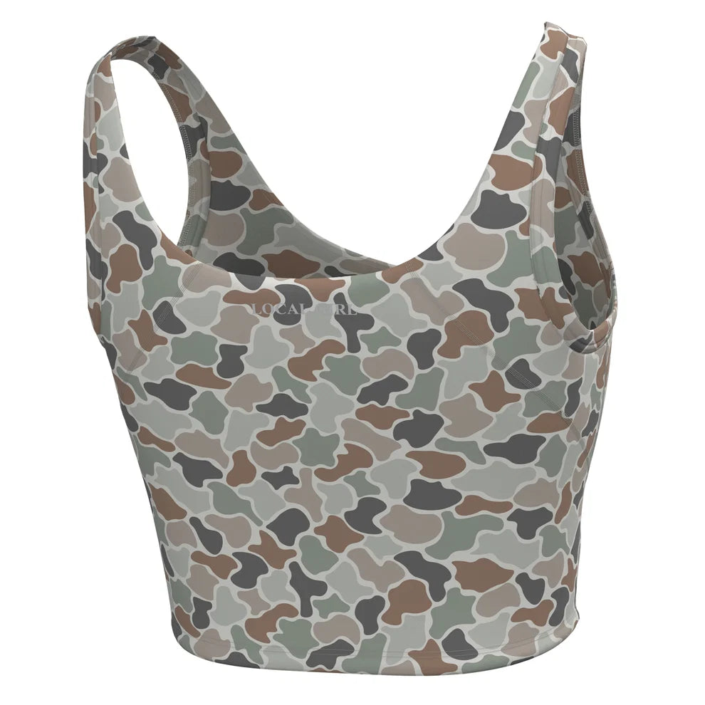 Pink sports bra with 'LOCAL GIRL' branding on a white background