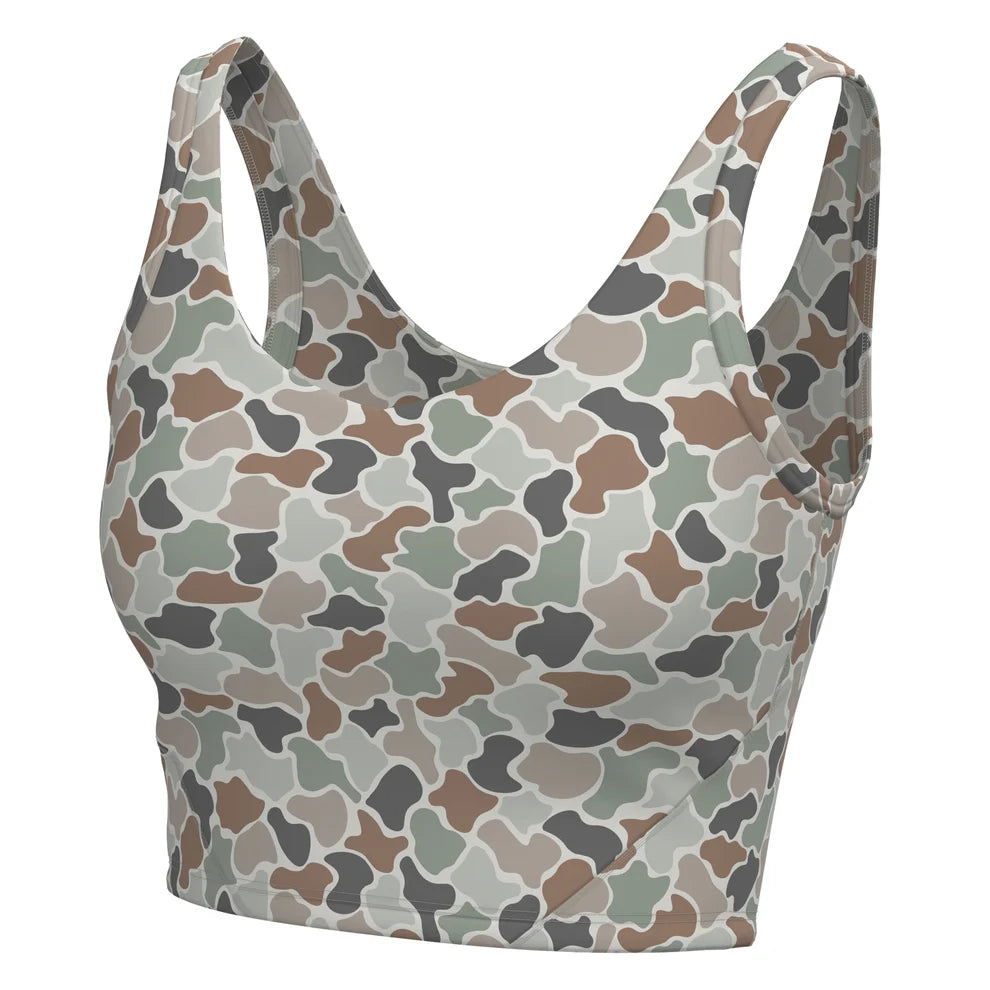 A women's sports bra with a camouflage pattern in shades of brown, beige, gray, and green, shown against a plain white background.